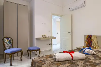 Letto o letti in una camera di Corinzia Casa Vacanze