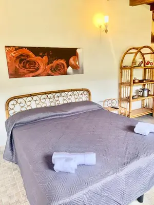 Letto o letti in una camera di VILLINO LELLA