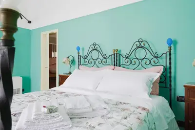 Letto o letti in una camera di Casa Tiffany