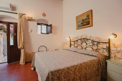 Letto o letti in una camera di Hotel Villa Giulia
