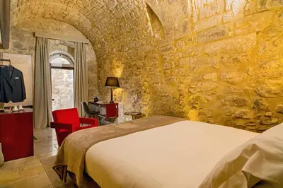 Letto o letti in una camera di Locanda Don Serafino Historical Boutique Hotel