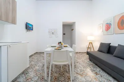 Area soggiorno di GuestHost - Via Malta Cozy Apartments near Ortigia