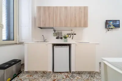 Cucina o angolo cottura di GuestHost - Via Malta Cozy Apartments near Ortigia
