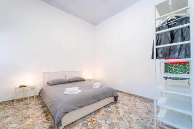 Letto o letti in una camera di GuestHost - Via Malta Cozy Apartments near Ortigia