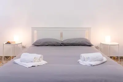 Letto o letti in una camera di GuestHost - Via Malta Cozy Apartments near Ortigia