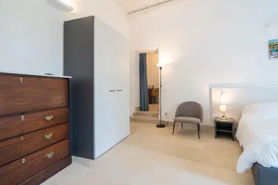 Letto o letti in una camera di Borgo Vita Novella Resort