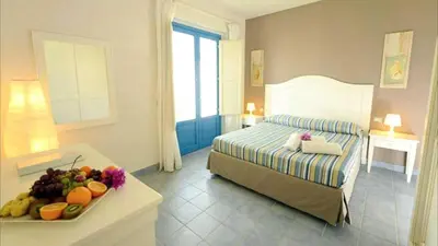 Letto o letti in una camera di Borgo Rio Favara Hotel Club