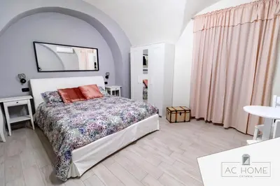 Letto o letti in una camera di AC HOME