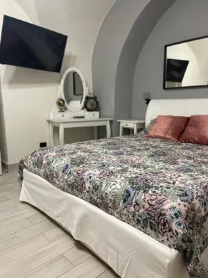Letto o letti in una camera di AC HOME