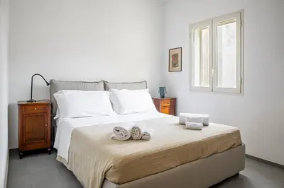Letto o letti in una camera di Casa Keller con Terrazza by Wonderful Italy