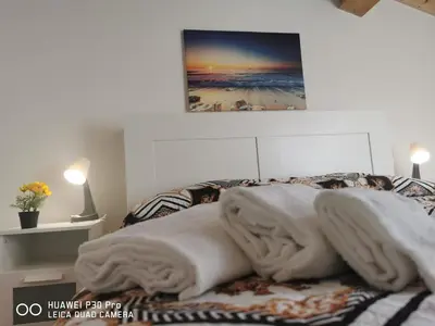 Letto o letti in una camera di Il Giardino in centro