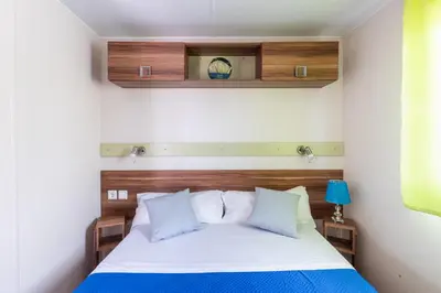 Letto o letti in una camera di Residence Il Borgo