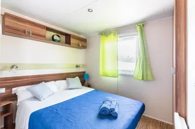 Letto o letti in una camera di Residence Il Borgo