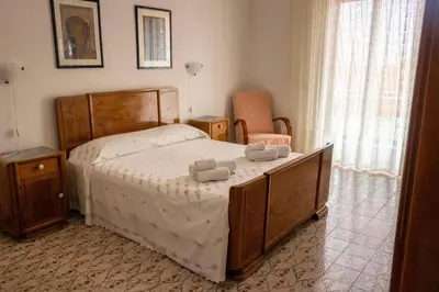 Letto o letti in una camera di Casa Raffaela