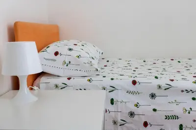 Letto o letti in una camera di Casa Raffaela
