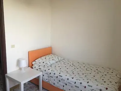 Letto o letti in una camera di Casa Raffaela
