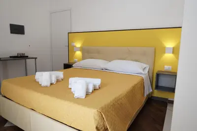 Letto o letti in una camera di Al Teatro Greco