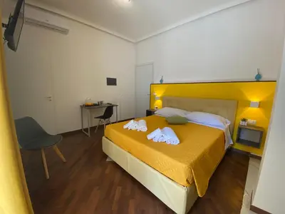 Letto o letti in una camera di Al Teatro Greco