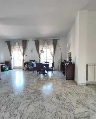 Area soggiorno di L'Attico - Stanza privata con bagno - Teatro Greco Siracusa