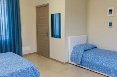 Letto o letti in una camera di Oikos - Ragusa Ibla