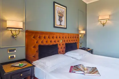 Letto o letti in una camera di Grand Hotel Villa Politi