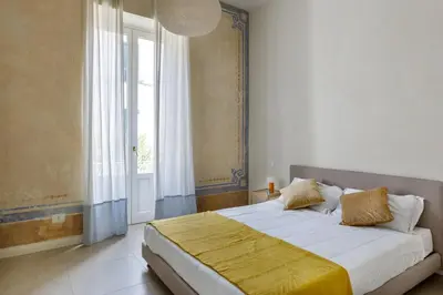 Letto o letti in una camera di Ortigia Amazing Apartment