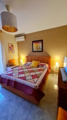 Letto o letti in una camera di Casa Vacanze La Melagrana