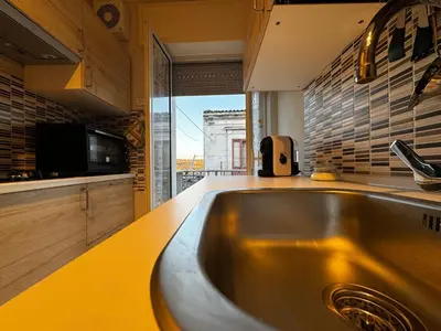 Cucina o angolo cottura di Casa Vacanze La Melagrana