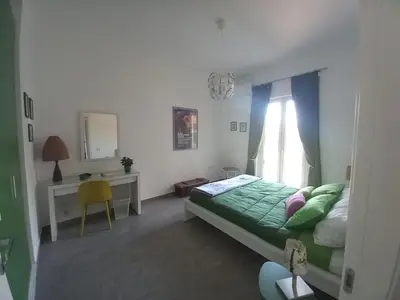 Letto o letti in una camera di Lo scorcio della Neapolis Accogliente appartamento pressi parco Neapolis