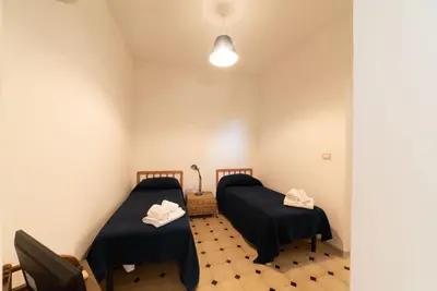 Letto o letti in una camera di Borgo Marino Plemmirio