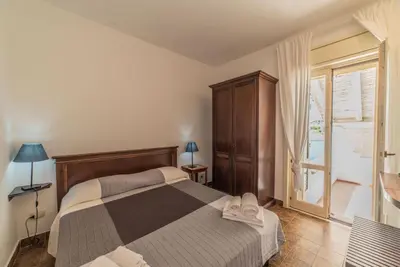 Letto o letti in una camera di Borgo Marino Plemmirio
