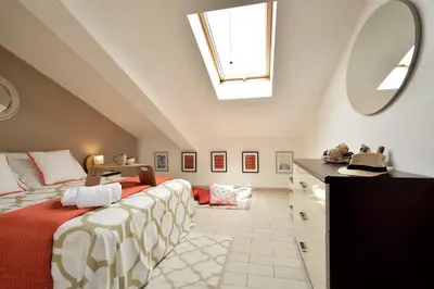 Letto o letti in una camera di Attico Vista Mare e Piscina