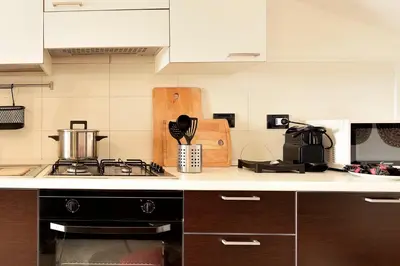 Cucina o angolo cottura di Attico Vista Mare e Piscina