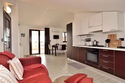 Cucina o angolo cottura di Attico Vista Mare e Piscina