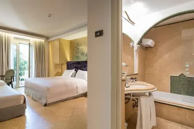 Letto o letti in una camera di Romano Palace Luxury Hotel
