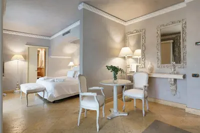 Letto o letti in una camera di Romano Palace Luxury Hotel