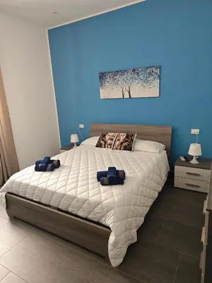 Letto o letti in una camera di La casa di Alessandro