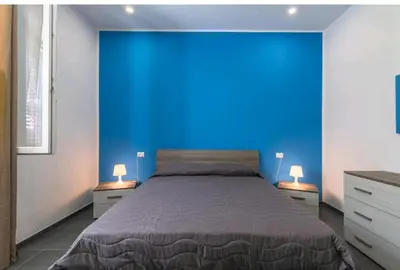 Letto o letti in una camera di La casa di Alessandro