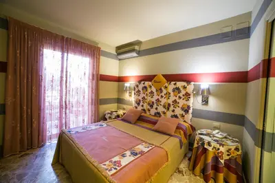 Letto o letti in una camera di Hotel Villamare