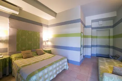 Letto o letti in una camera di Hotel Villamare