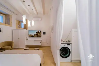 Letto o letti in una camera di Casa Tal - Exclusive home in Ortigia