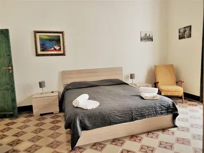 Letto o letti in una camera di Residenza Diana- Ortigia Holidays