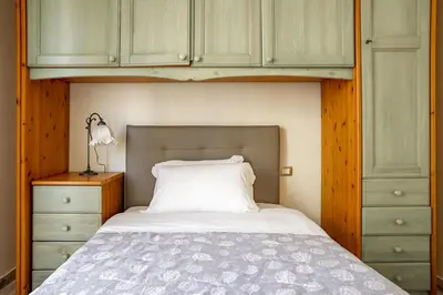 Letto o letti in una camera di Ortigia Seafront Apartment by Wonderful Italy