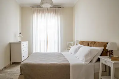 Letto o letti in una camera di Ortigia Seafront Apartment by Wonderful Italy