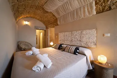 Letto o letti in una camera di GuestHost - Il Dammuso di Ortigia - Lovely Sea View Apartment
