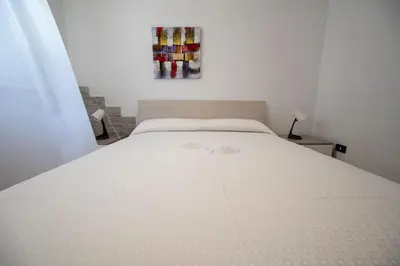 Letto o letti in una camera di Villa Danilo - Sicilia Vacanza