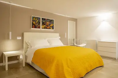 Letto o letti in una camera di Helios Duplex a due passi da Ortigia by Wonderful Italy