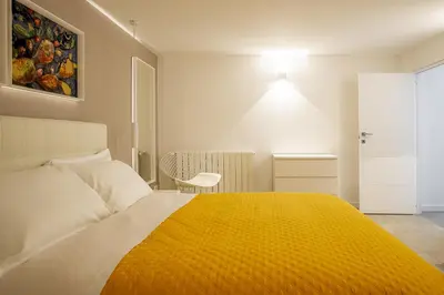 Letto o letti in una camera di Helios Duplex a due passi da Ortigia by Wonderful Italy