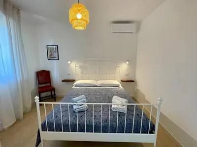 Letto o letti in una camera di Cuore di Ognina - Appartamenti vista mare