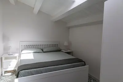 Letto o letti in una camera di Casa Gioconda